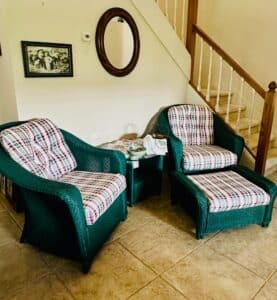 Wicker-Armchair-with-Ottoman-and-Plaid-Cushions