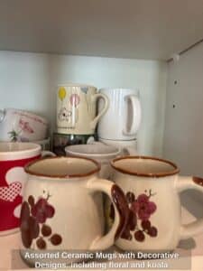Assorted-Ceramic-Mugs-with-Decorative-Designs-including-floral-and-koala-motifs-2