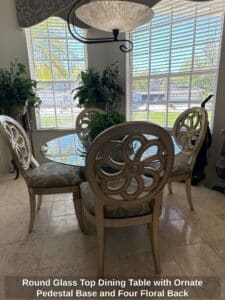 Round-Glass-Top-Dining-Table-with-Ornate-Pedestal-Base-and-Four-Floral-Back-Upholstered-Chairs-1