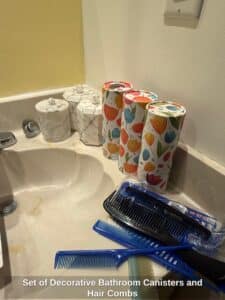 Set-of-Decorative-Bathroom-Canisters-and-Hair-Combs-1