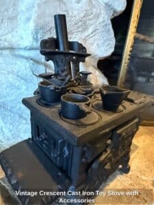 Vintage-Crescent-Cast-Iron-Toy-Stove-with-Accessories-fourth-image-1