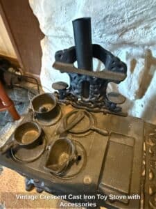Vintage-Crescent-Cast-Iron-Toy-Stove-with-Accessories-second-image-1