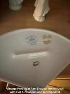 Vintage-Porcelain-Fan-Shaped-Trinket-Dish-with-Hot-Air-Balloon-and-Airship-Motif-third-image