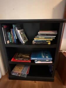 Black-Wooden-Bookshelf-with-Assorted-Books