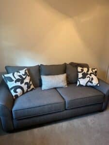 Charcoal-Gray-Upholstered-Sofa-with-Decorative-Pillows