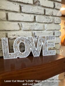Laser-Cut-Wood-LOVE-Sign-with-Mushroom-and-Leaf-Design