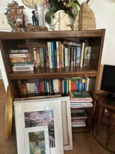Oak-Bookshelf-with-Assorted-Books-and-Artwork