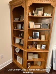 Oak-Corner-Curio-Cabinet-with-Carved-Detailing