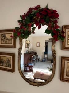 Ornate-Gilt-Oval-Mirror-with-Faux-Poinsettia-Garland