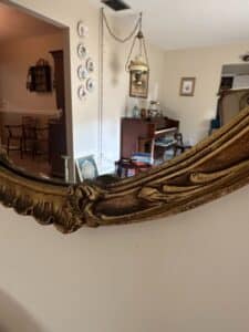 Ornate-Gilt-Oval-Mirror-with-Faux-Poinsettia-Garland-second-image