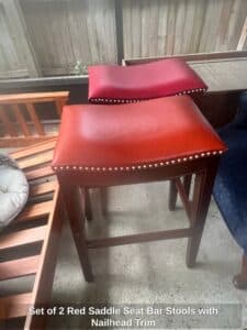 Set-of-Red-Saddle-Seat-Bar-Stools-with-Nailhead-Trim
