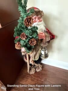 Standing-Santa-Claus-Figure-with-Lantern-and-Tree