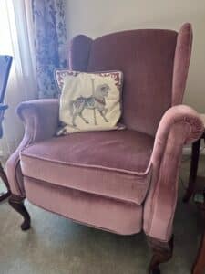 Velvet-Wingback-Armchair-with-Carousel-Horse-Pillow