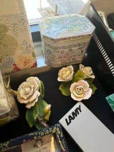 Vintage-Porcelain-Rose-Figurines-with-Decorative-Octagonal-Tin