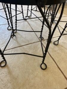 Wrought-Iron-Bistro-Set-with-Heart-Back-Chairs-and-Amber-Glass-Oil-Lamp-fourth-image