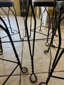 Wrought-Iron-Bistro-Set-with-Heart-Back-Chairs-and-Amber-Glass-Oil-Lamp-sixth-image