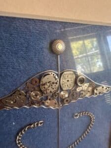 Caduceus-Assemblage-Art-with-Watch-Parts-and-Chain-second-image