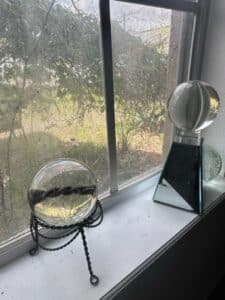 Glass-Sphere-on-Twisted-Metal-Stand-and-Geometric-Glass-Sculpture