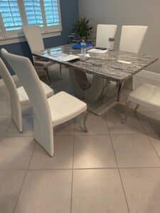 $1200 Six White Dining Chairs + MarbleEffect Pedestal Table