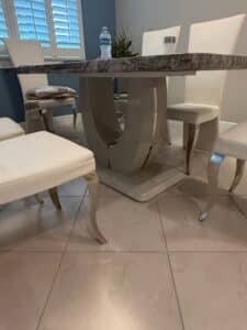 Modern-Faux-Marble-Dining-Table-Set-with-U-Shaped-Base-and-White-Upholstered-Chairs