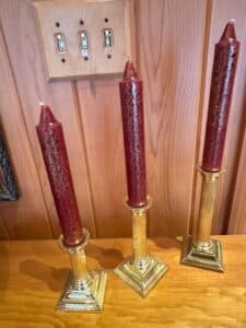 Set-of-Brass-Candlesticks-with-Red-Speckled-Taper-Candles