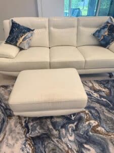 Sofia-Vergara-White-Leather-Sofa-with-Ottoman