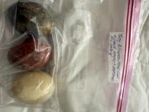 Three-Polished-Stone-Eggs-in-Granite-Marble-and-Serpentine