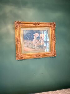 Victorian-style-painting-of-women-in-a-garden-signed-K.-Elm