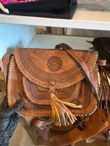 Vintage-Tooled-Leather-Shoulder-Bag-with-Tassel-and-Medallion