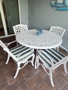 White-Cast-Aluminum-Lattice-Patio-Dining-Set-with-Chairs-and-Striped-Cushions