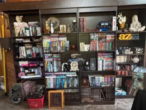 Assorted-Books-by-J.D.-Robb-and-Jayne-Ann-Krentz-and-Decorative-Items