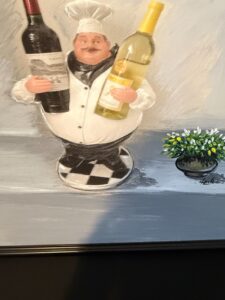 Chef-Holding-Two-Wine-Bottles-Sculpture