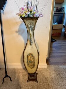 Distressed-Metal-Vase-with-Scrollwork-Stand