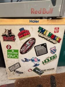 Haier-Mini-Refrigerator-with-Assorted-Action-Sports-Stickers-The-House-Boardshop-Evo-Nitro-K-Swiss-Red-Bull-1
