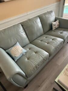 Light-Gray-Leather-Sofa-with-Tufted-Cushions-1