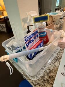 Assorted-Household-Cleaning-Supplies-Caddy-with-Pumie-Scouring-Stick-and-Carbona-Carpet-Cleaner