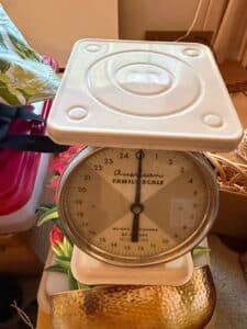 Collection-of-Assorted-Estate-Items-including-American-Family-Scale-Quartz-Clock-Golf-Ball-Coin-Bank-Soviet-Pins-and-Cassette-Tapes-fifth-image
