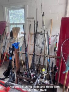 Assorted-Fishing-Rods-and-Reels-with-Wooden-Rod-Rack