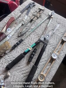Assorted-Hand-Tools-Bolt-Cutters-Loppers-Level-and-a-Hammer