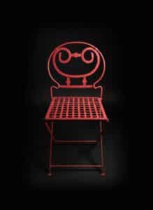 Vintage-Red-Metal-Folding-Chair-with-Decorative-Scrollwork