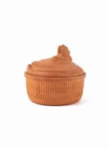 Vintage-Farmhouse-Kitchen-Wall-Display-with-Terracotta-Hen-Baker-and-Green-Handled-Utensils-second-image