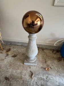 Faux-Cast-Stone-Pedestal-with-Copper-Gazing-Ball