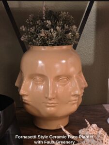 Fornasetti-Style-Ceramic-Face-Planter-with-Faux-Greenery