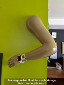 Mannequin-Arm-Sculpture-with-Vintage-Watch-and-Apple-Watch