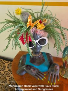 Mannequin-Hand-Vase-with-Faux-Floral-Arrangement-and-Sunglasses