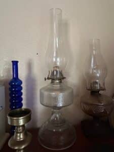 Collection-of-Vintage-Oil-Lamps-Brass-Candlestick-and-Cobalt-Blue-Bottle-fourth-image