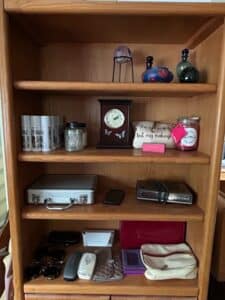 Oak-Veneer-Bookcase-with-Assorted-Decorative-and-Personal-Items