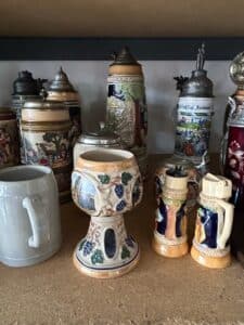 Collection-of-German-Beer-Steins-and-Decorative-Plates-including-Los-Angeles-Olympic-Stein-and-Mnchen-Crest-Plaque-second-image-1