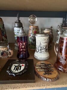 Collection-of-German-Beer-Steins-and-Decorative-Plates-including-Los-Angeles-Olympic-Stein-and-Mnchen-Crest-Plaque-third-image-1