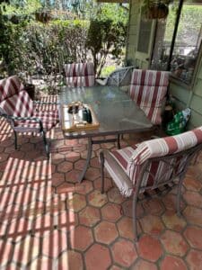 Patio-Dining-Set-with-Glass-Top-Table-and-Striped-Cushioned-Chairs